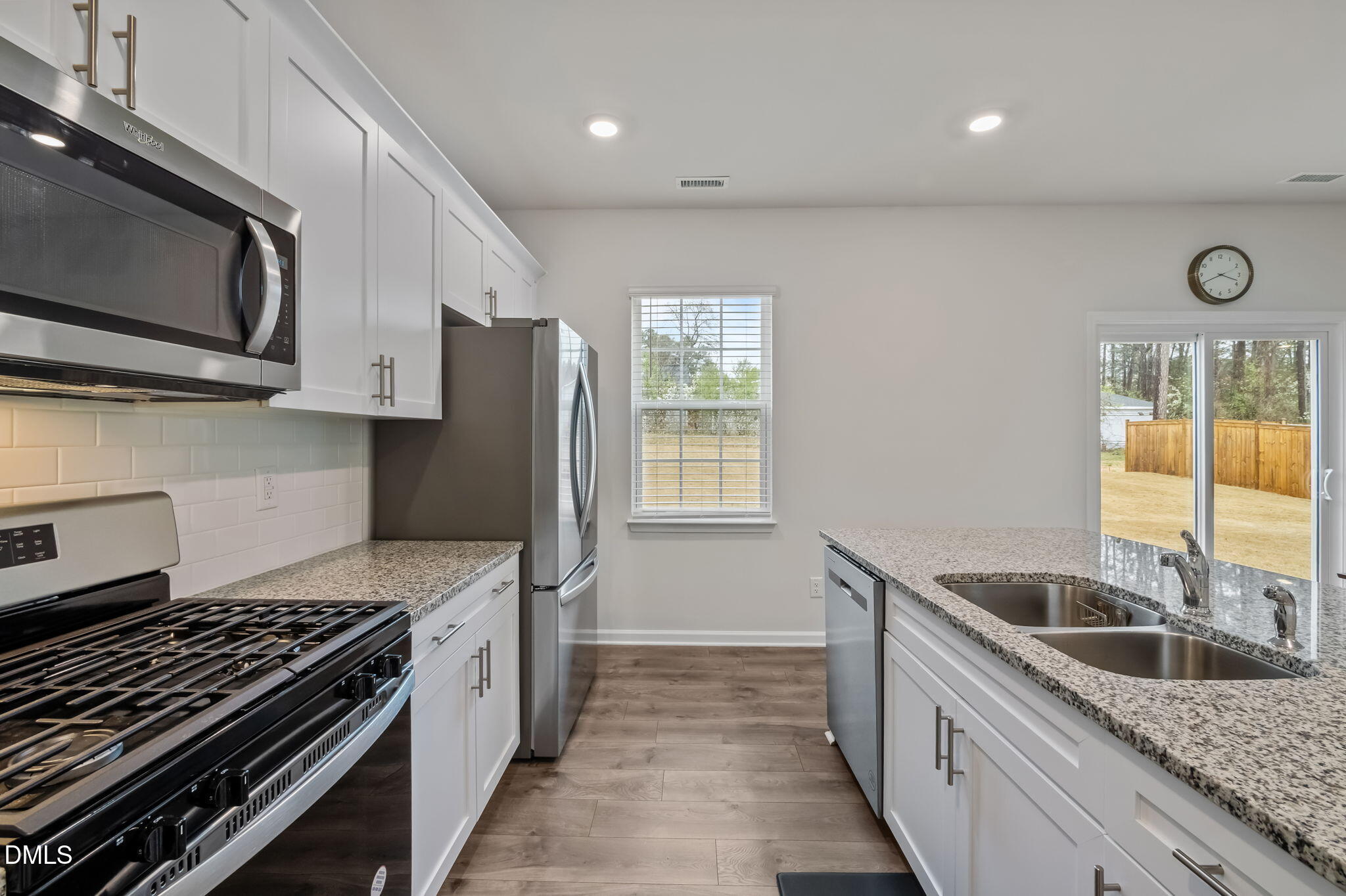 2113 Fletchers Ridge Drive Durham, NC 27703 - Photo 17 of 54 a kitchen with a sink stove top oven and refrigerator