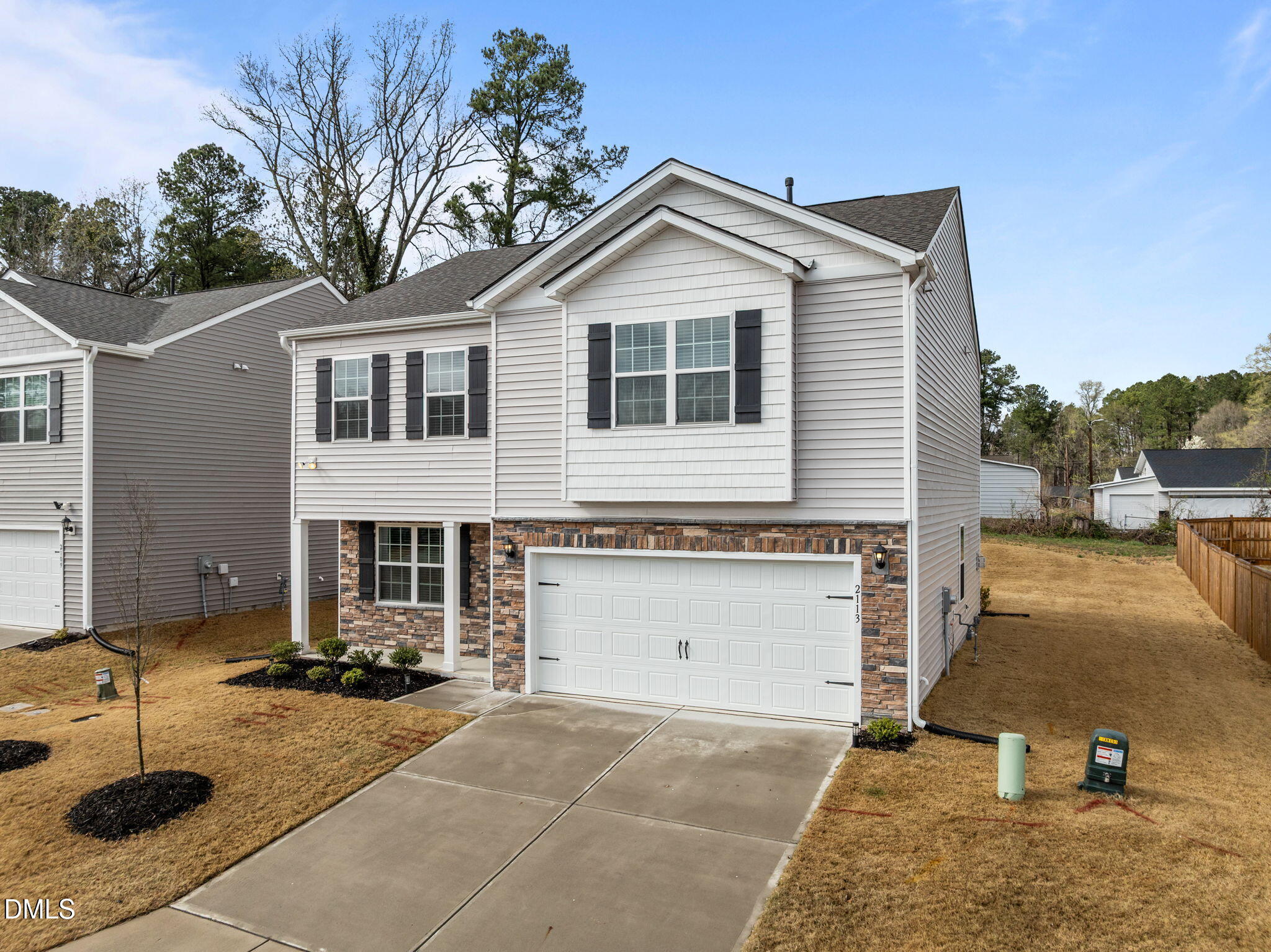 2113 Fletchers Ridge Drive Durham, NC 27703 - Photo 2 of 54 a front view of a house with a yard