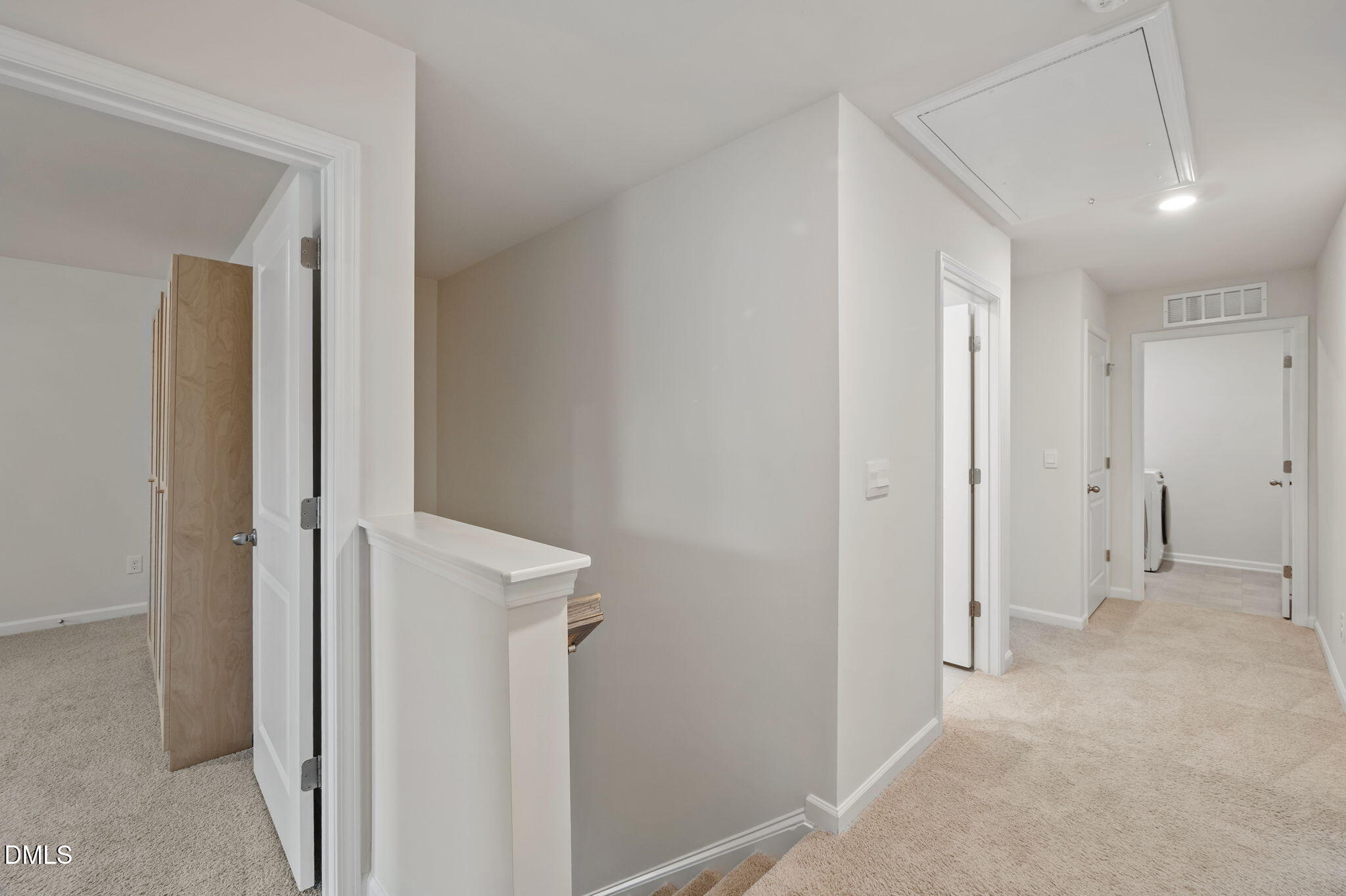 2113 Fletchers Ridge Drive Durham, NC 27703 - Photo 22 of 54 a view of a hallway with closet and wooden floor