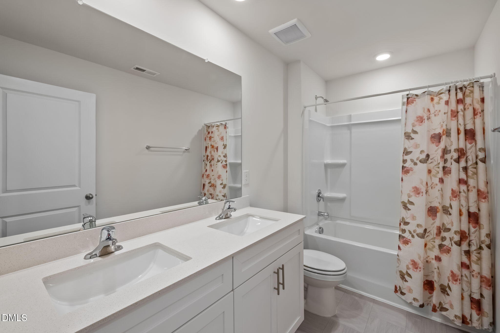 2113 Fletchers Ridge Drive Durham, NC 27703 - Photo 27 of 54 a bathroom with a sink toilet a shower and a mirror