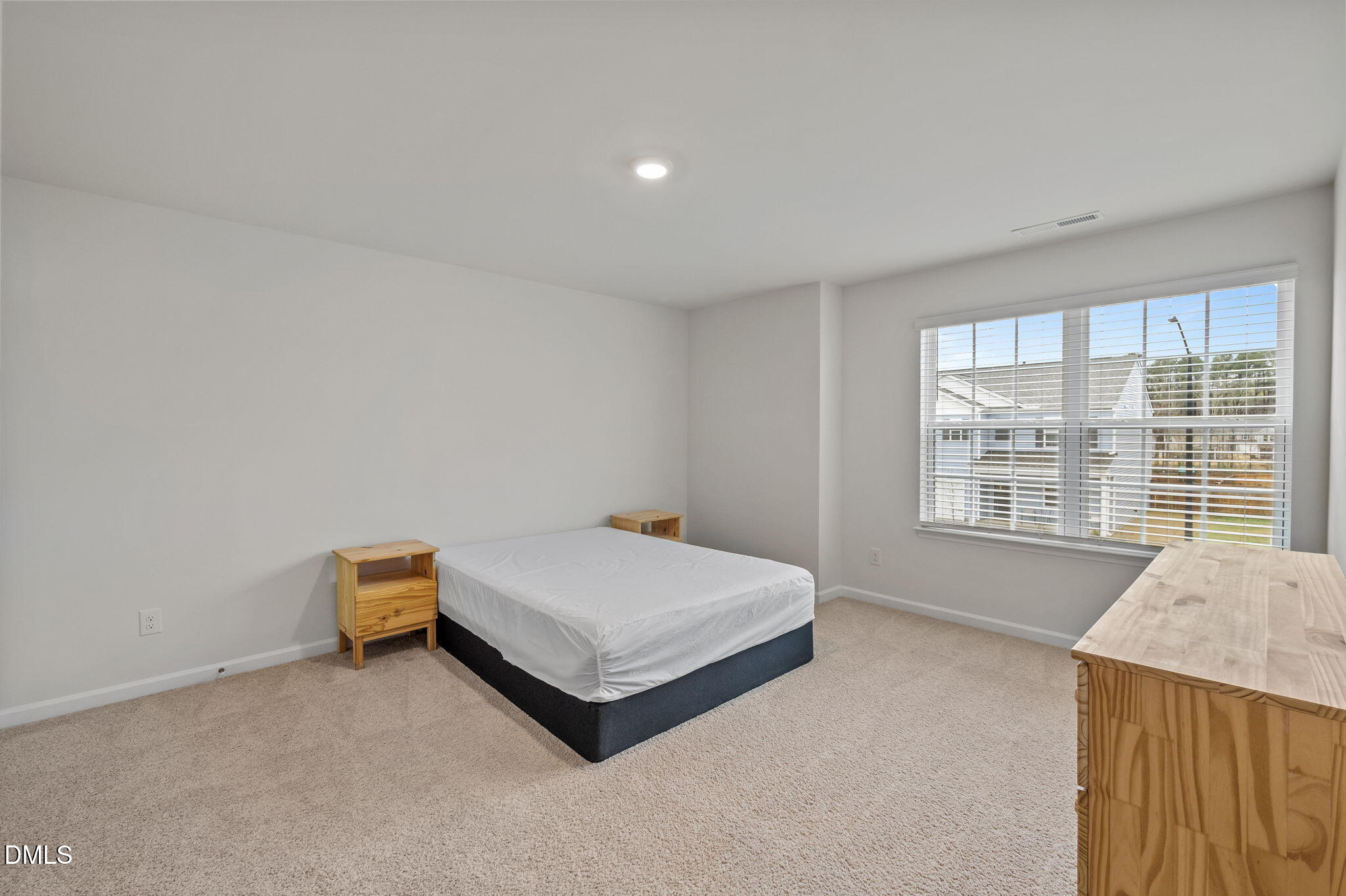 2113 Fletchers Ridge Drive Durham, NC 27703 - Photo 28 of 54 a room with a bed and a window