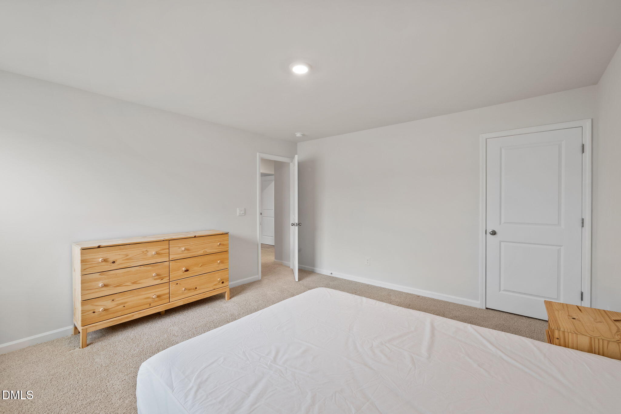 2113 Fletchers Ridge Drive Durham, NC 27703 - Photo 29 of 54 a bedroom with a bed and a dresser