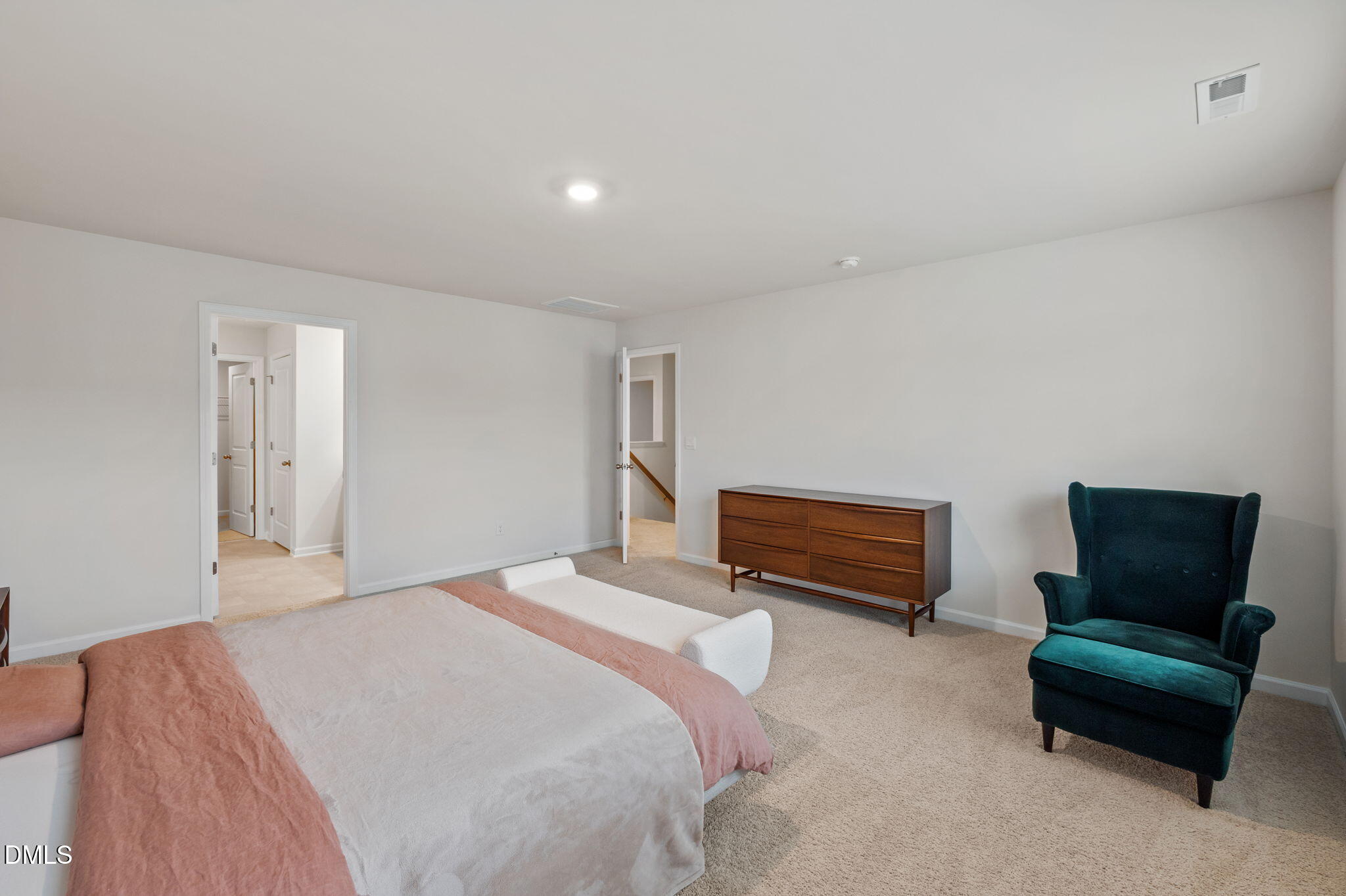 2113 Fletchers Ridge Drive Durham, NC 27703 - Photo 32 of 54 a bedroom with a bed and a couch