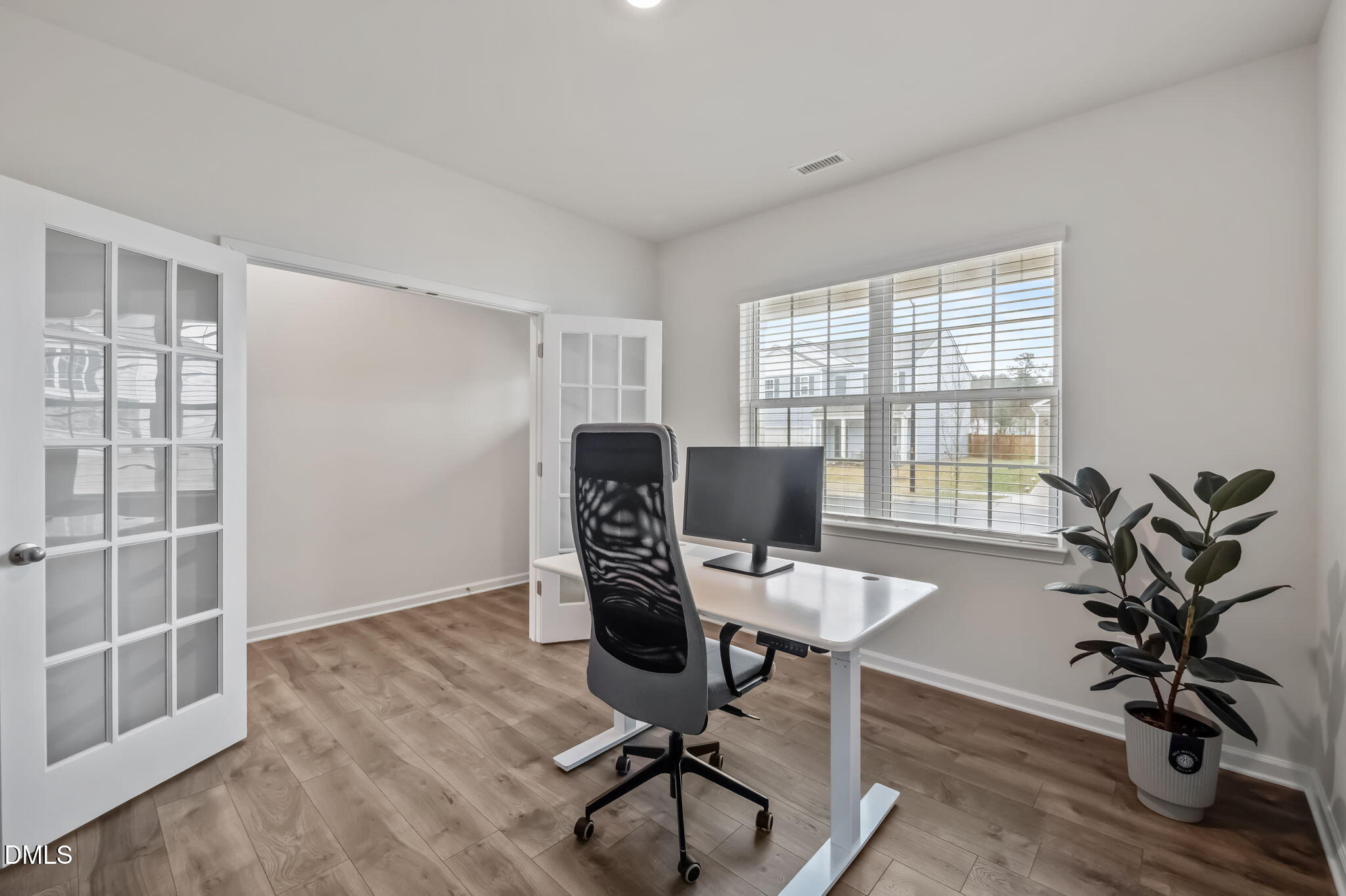 2113 Fletchers Ridge Drive Durham, NC 27703 - Photo 8 of 54 a view of a workspace with furniture and a window