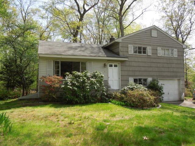 8 Box Wood Road Norwalk, CT 06851 - Photo 1 of 1 a front view of a house with a garden