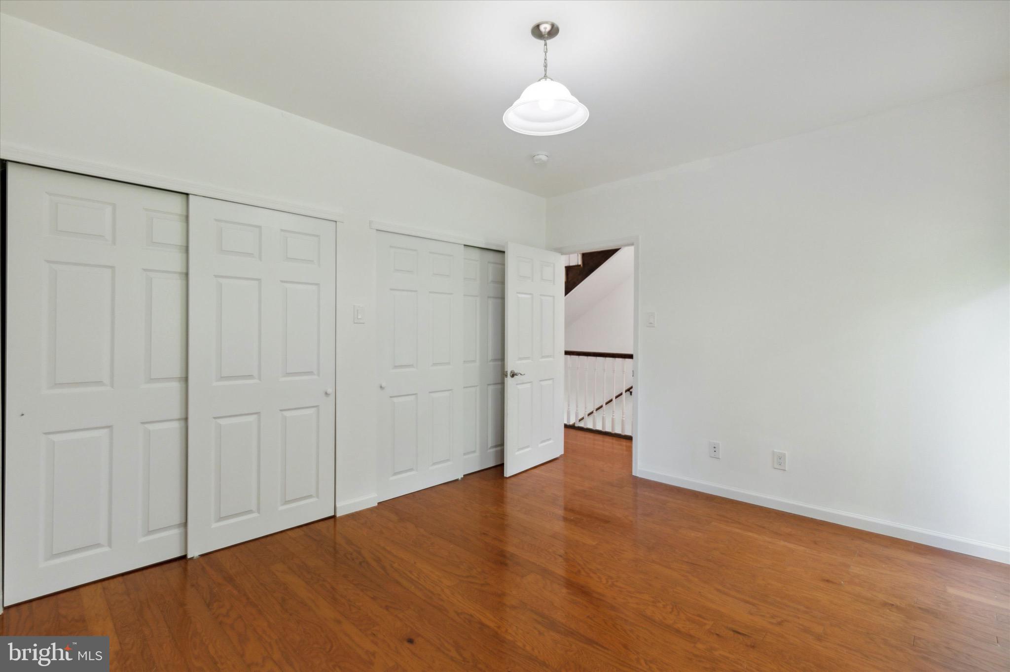 997 Camp Road Telford, PA 18969 - Photo 12 of 25 a view of empty room with wooden floor and fan
