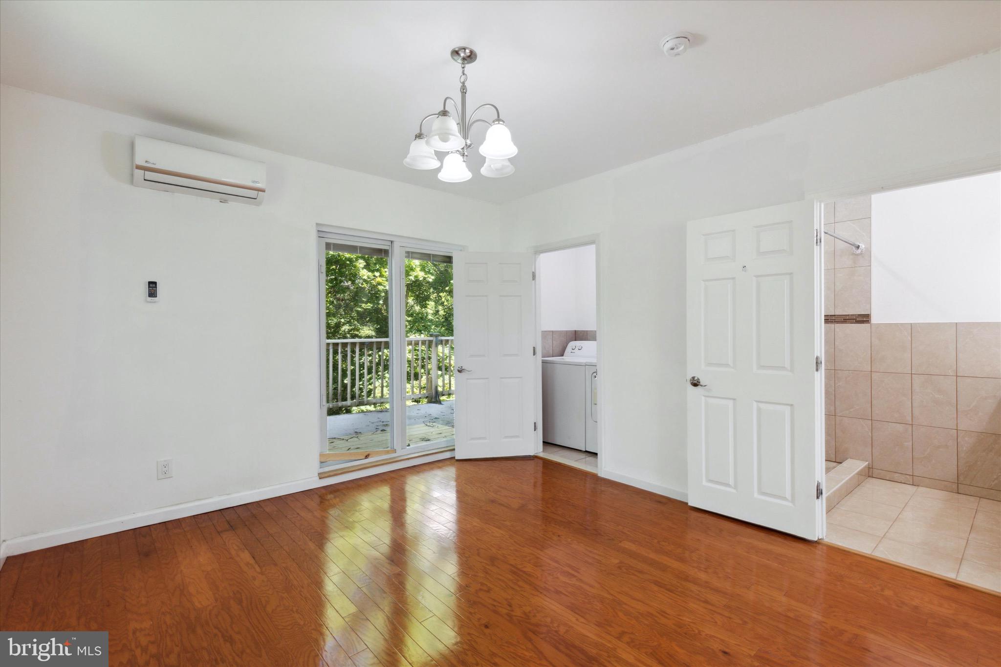 997 Camp Road Telford, PA 18969 - Photo 16 of 25 wooden floor in an empty room with a window