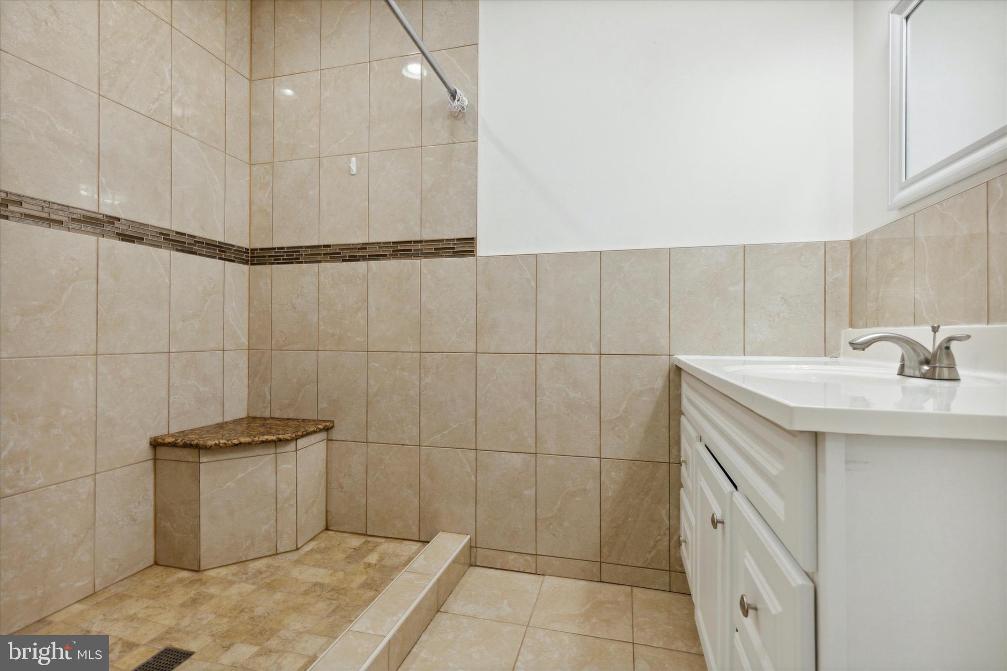 997 Camp Road Telford, PA 18969 - Photo 18 of 25 a bathroom with a sink and shower