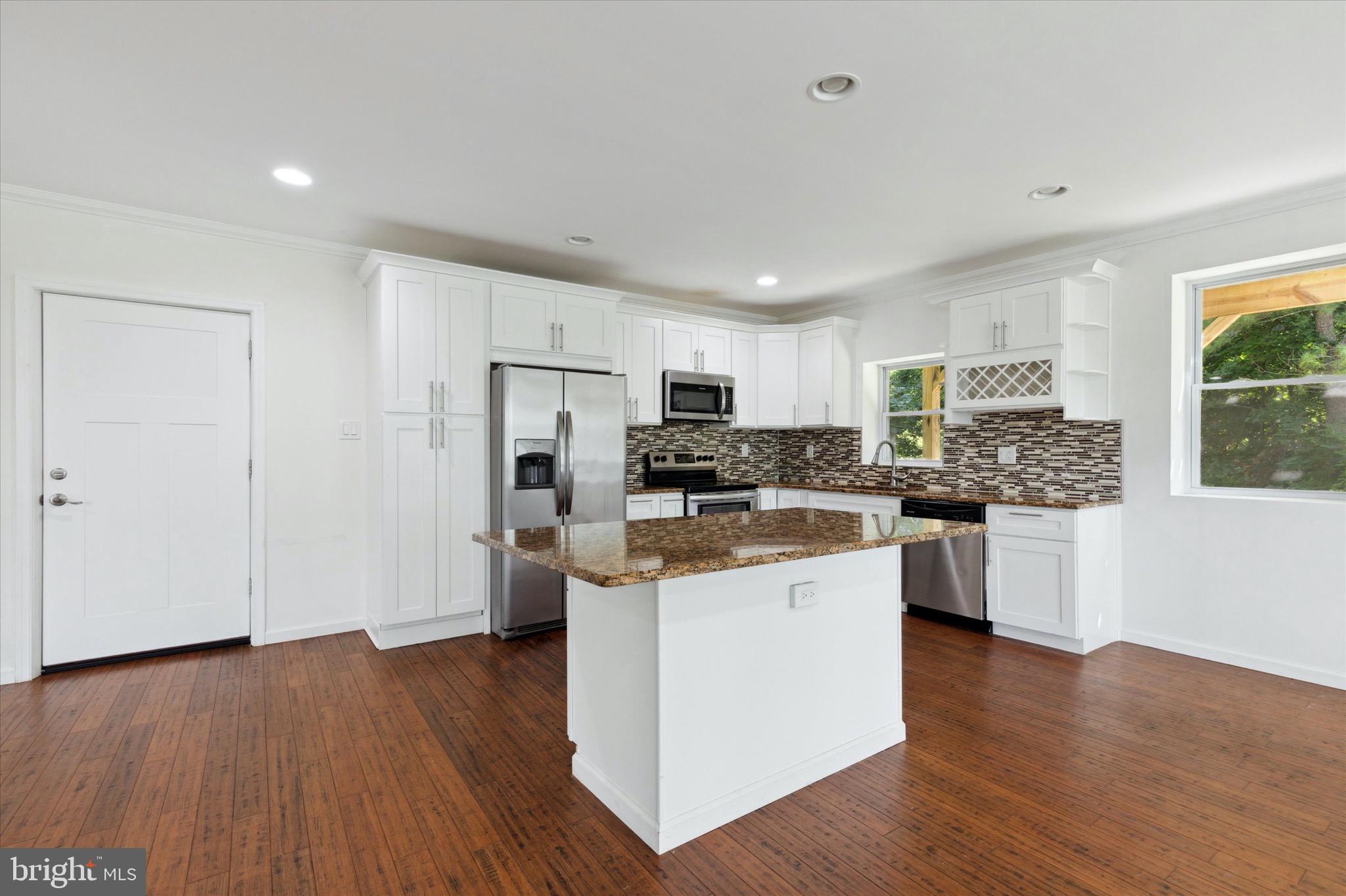 997 Camp Road Telford, PA 18969 - Photo 4 of 25 a kitchen with stainless steel appliances a refrigerator and a stove top oven