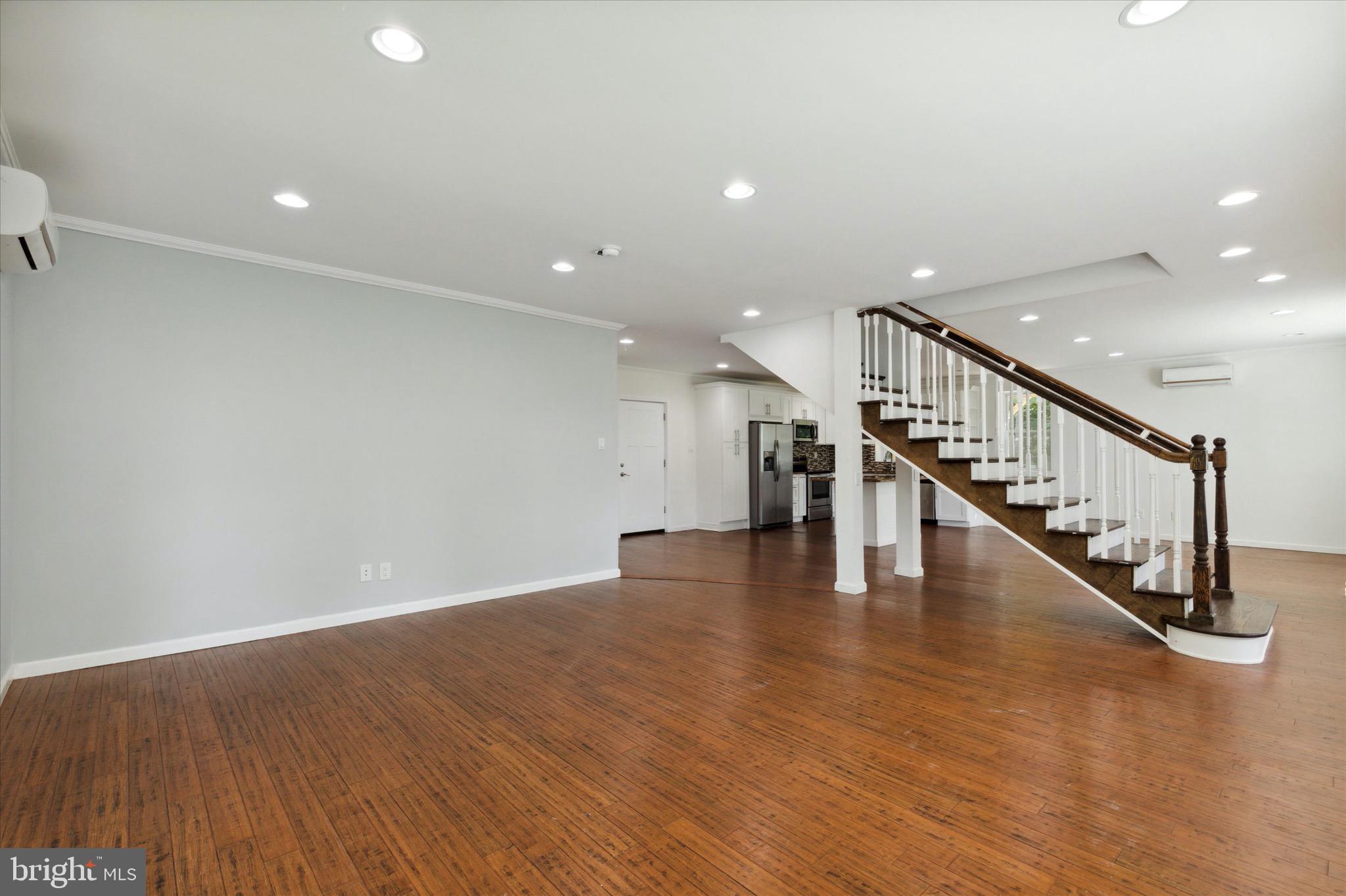 997 Camp Road Telford, PA 18969 - Photo 6 of 25 a view of staircase and kitchen with wooden floor