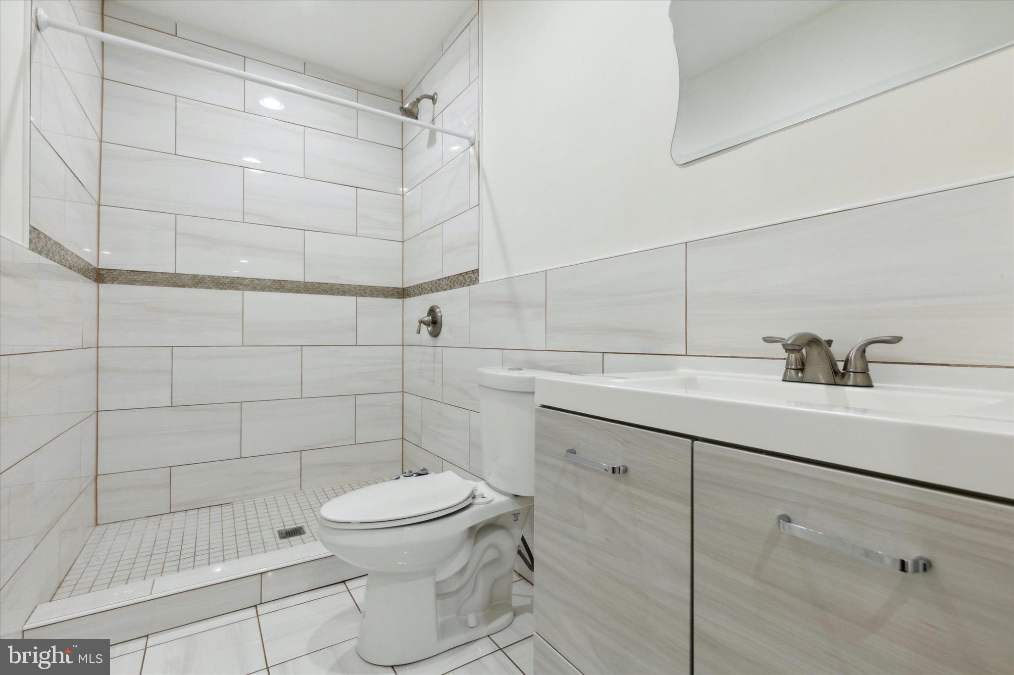 997 Camp Road Telford, PA 18969 - Photo 10 of 25 a bathroom with a sink toilet and shower