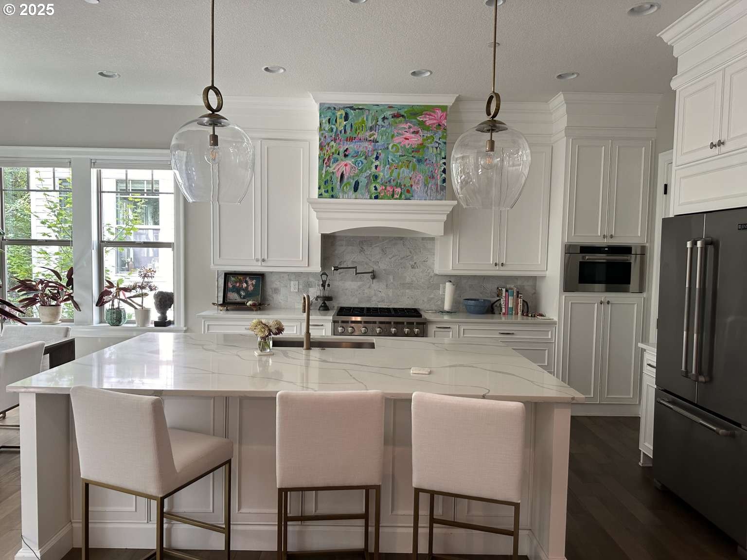 7535 Northwest Quinault Street Camas, WA 98607 - Photo 2 of 27 a kitchen with refrigerator and chairs