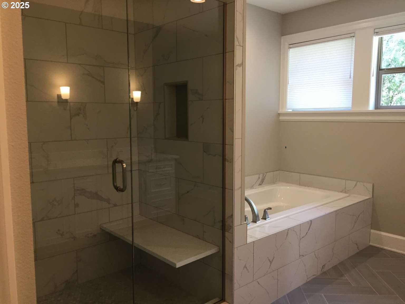 7535 Northwest Quinault Street Camas, WA 98607 - Photo 4 of 27 a bathroom with a bathtub a window and a shower