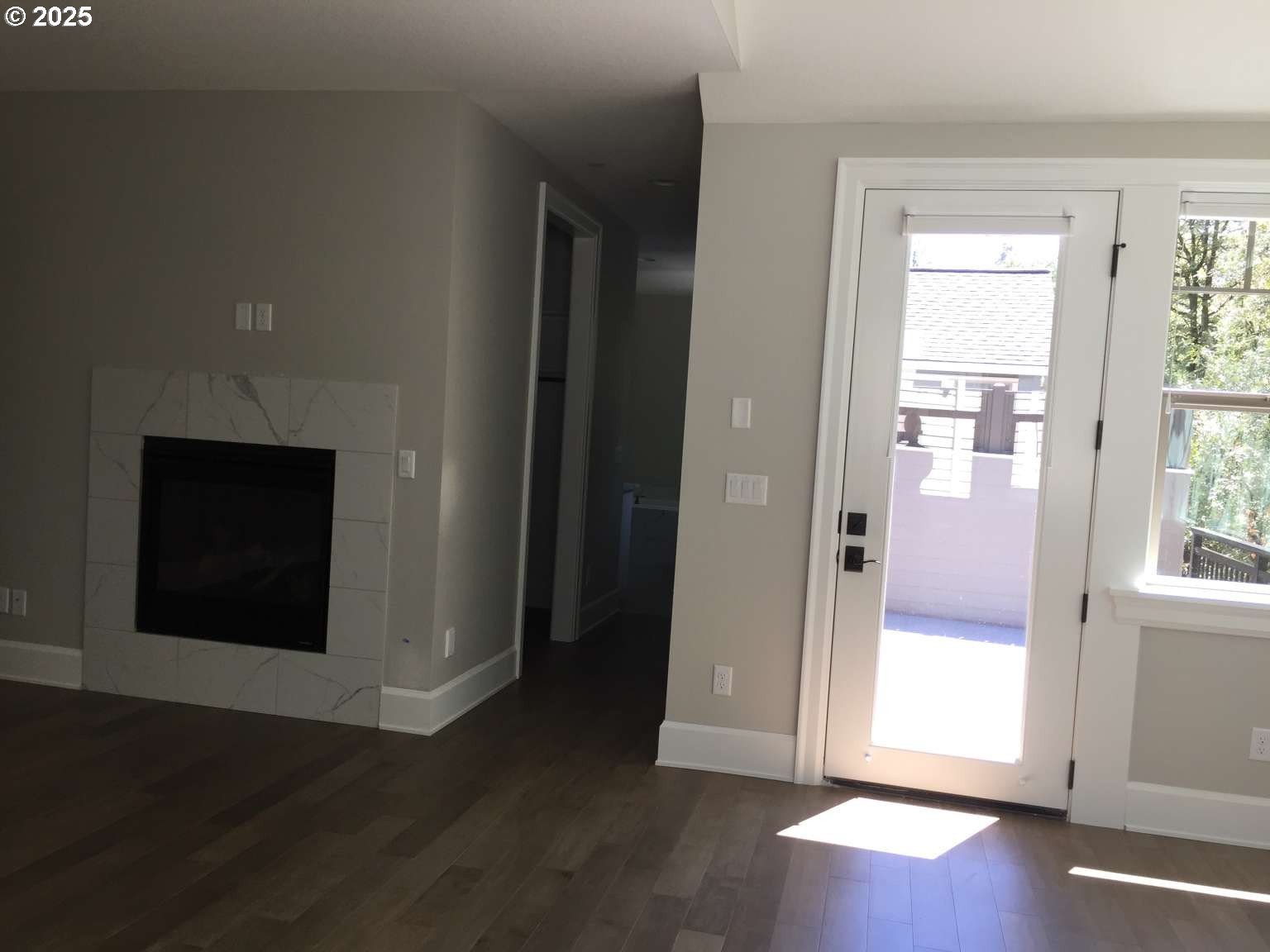 7535 Northwest Quinault Street Camas, WA 98607 - Photo 6 of 27 an entryway with wooden floor and windows