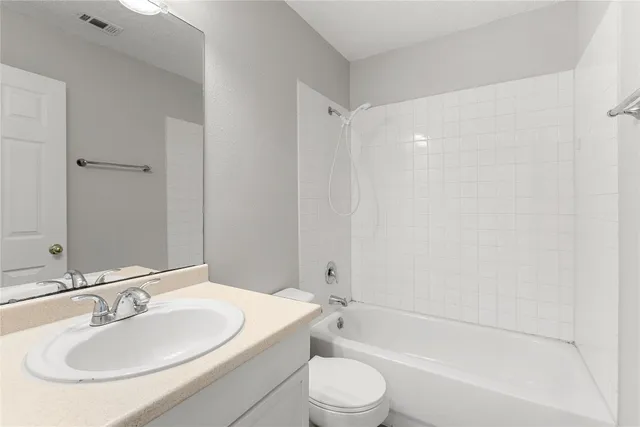 a bathroom with a toilet a sink and a bathtub