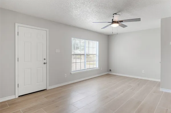 a view of an empty room with a window