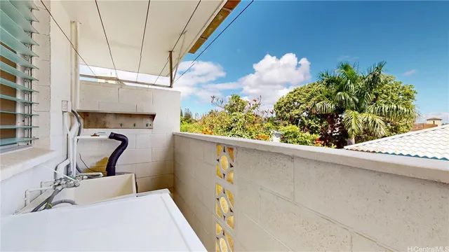 a bathroom with a sink mirror and window