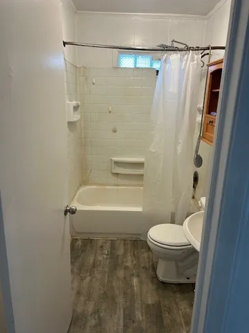 a kitchen with a refrigerator and a stove top oven