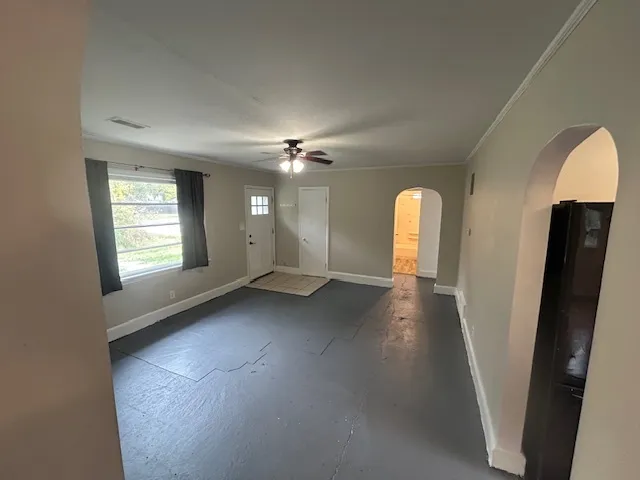 a view of a kitchen from a hallway