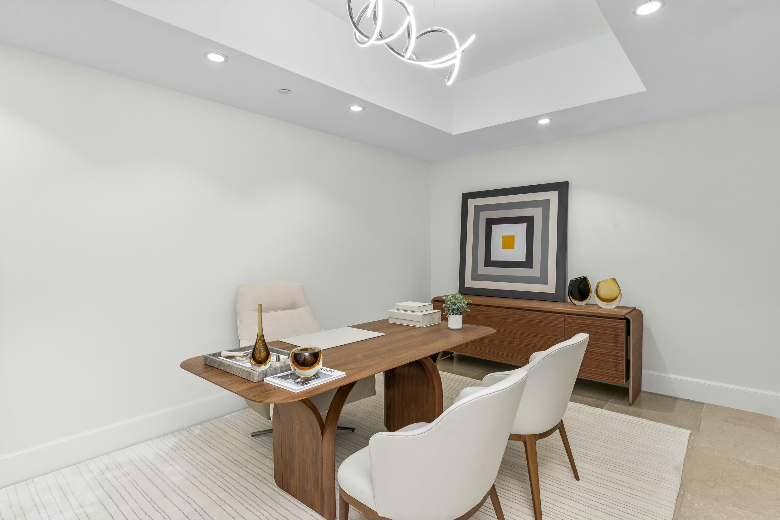 2500 South Ocean Boulevard, Unit 903 Boca Raton, FL 33432 - Photo 18 of 66 a dining room with a wooden table and chairs