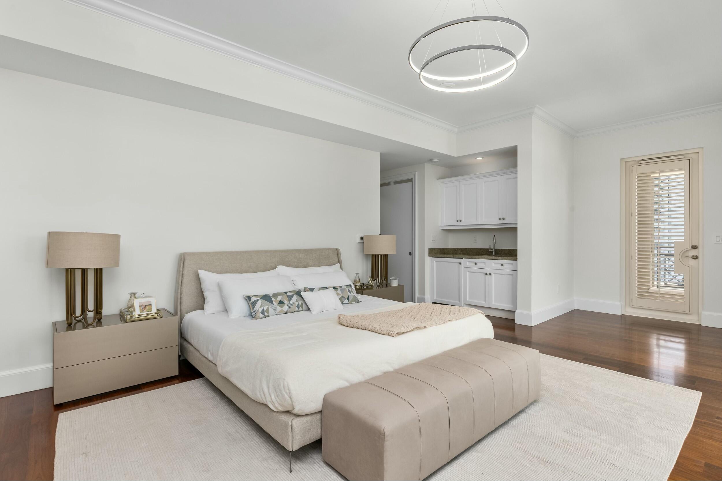 2500 South Ocean Boulevard, Unit 903 Boca Raton, FL 33432 - Photo 24 of 66 a bedroom with a bed and a cabinets