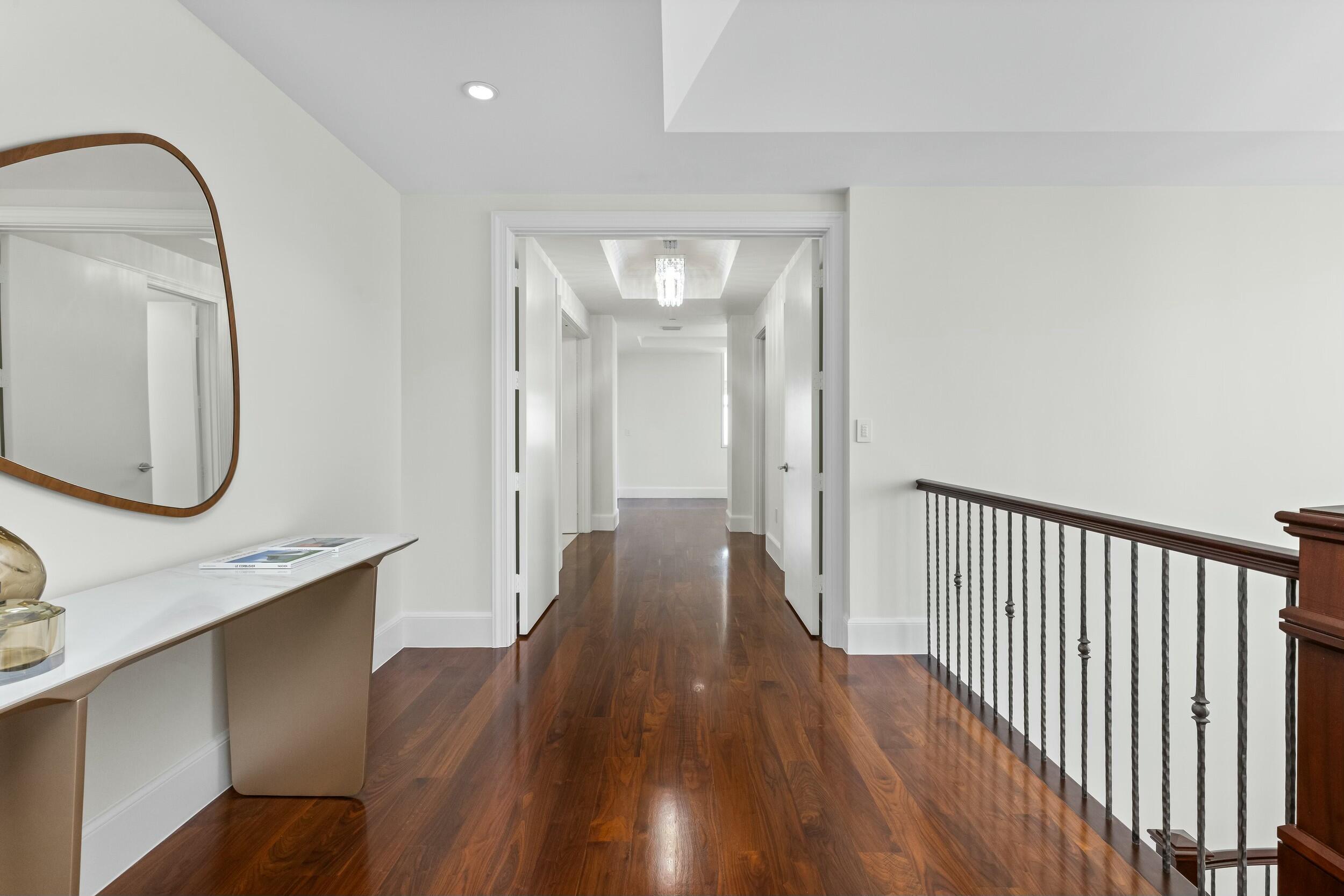 2500 South Ocean Boulevard, Unit 903 Boca Raton, FL 33432 - Photo 29 of 66 a view of a hallway with wooden floor and entryway
