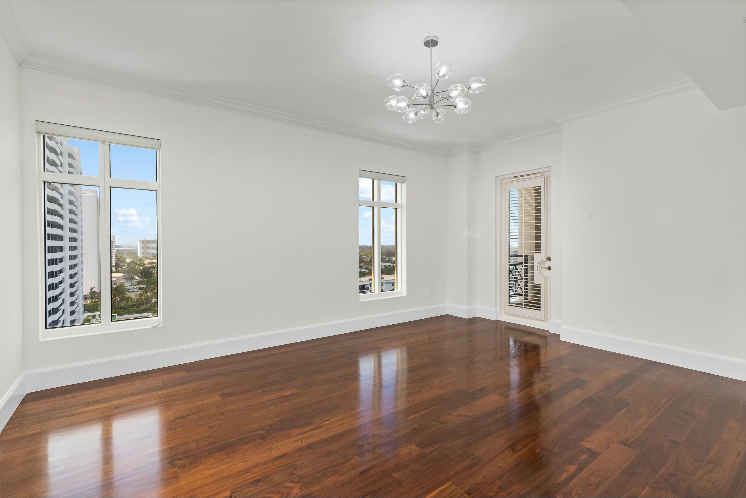 2500 South Ocean Boulevard, Unit 903 Boca Raton, FL 33432 - Photo 46 of 66 a view of an empty room with wooden floor and a window