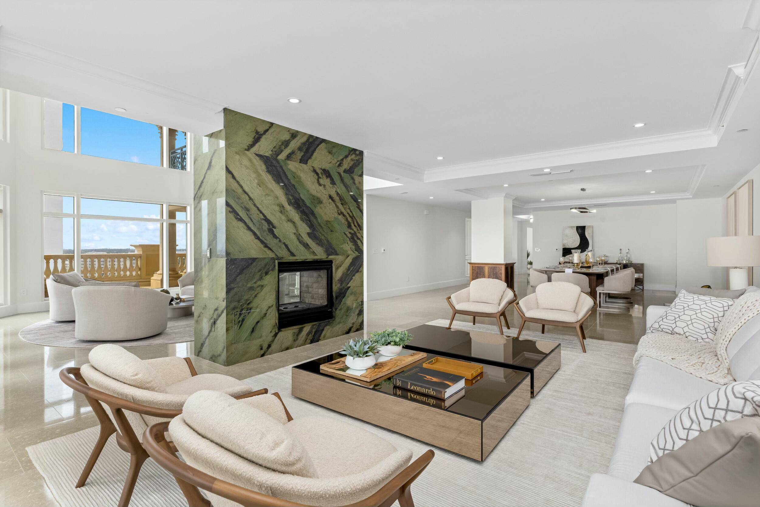 2500 South Ocean Boulevard, Unit 903 Boca Raton, FL 33432 - Photo 8 of 66 a living room with furniture a rug and a fireplace