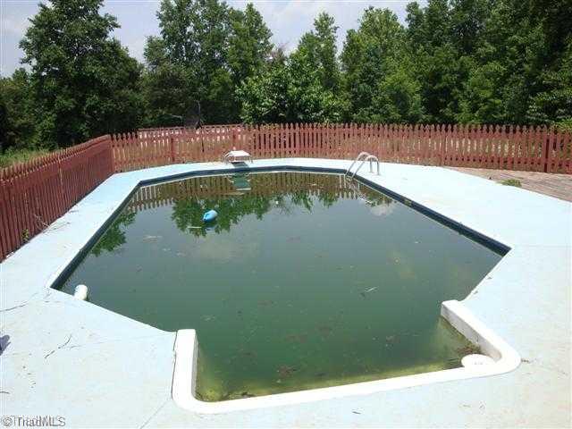 194 Golfcrest Road Denton, NC 27239 - Photo 3 of 8 Swimming Pool/Hot Tub/Sauna. Inground pool in fenced area with concrete sidewalk and deck, will be great when summer gets here.