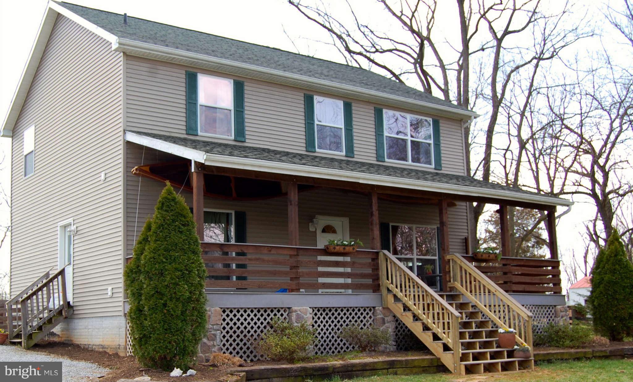 407 Stringtown Road Berryville, VA 22611 - Photo 1 of 30 front view of a house with a door