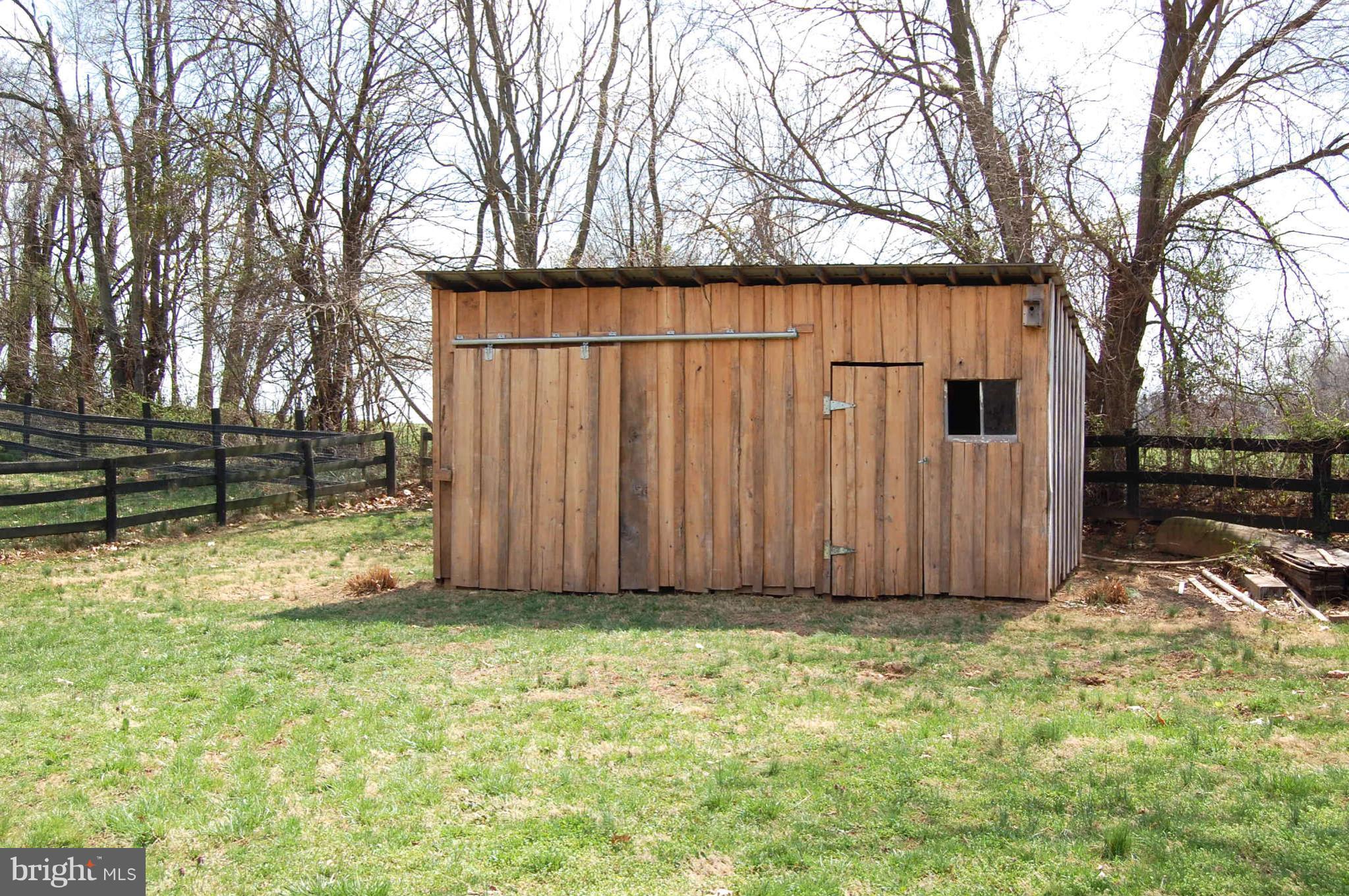 407 Stringtown Road Berryville, VA 22611 - Photo 5 of 30 a view of a backyard with wooden fence