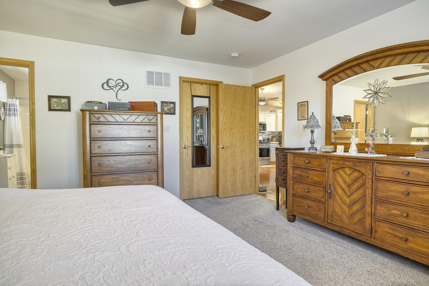 9815 Hart Street St. John, IN 46373 - Photo 13 of 19 a spacious bedroom with a bed and a dresser