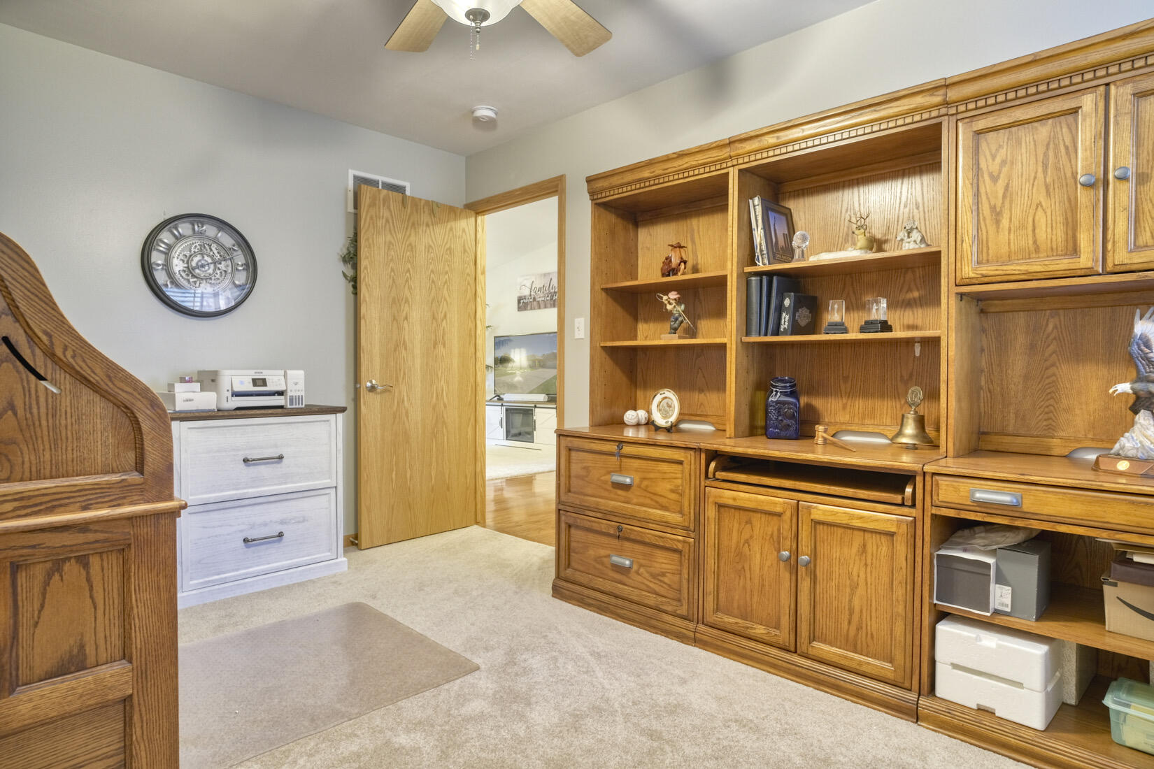 9815 Hart Street St. John, IN 46373 - Photo 17 of 19 a view of a kitchen with cabinets and wooden floor
