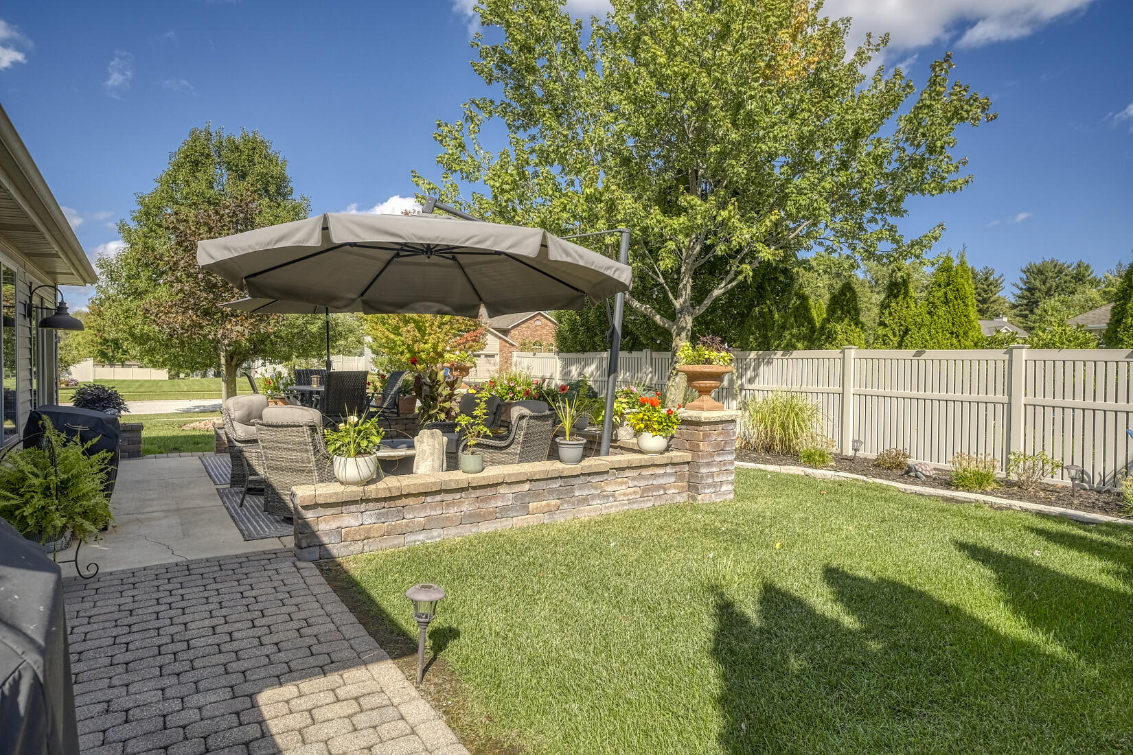 9815 Hart Street St. John, IN 46373 - Photo 3 of 19 a view of a backyard with sitting area