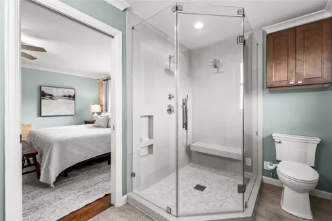 a view of a bathroom from a hallway
