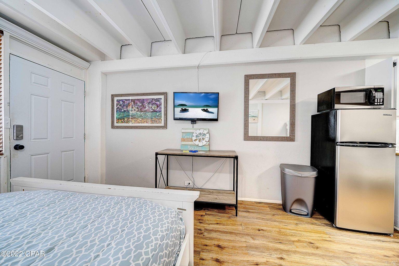 14401 Front Beach Road, Unit 434 Panama City Beach, FL 32413 - Photo 14 of 36 a view of a livingroom with furniture and a kitchen