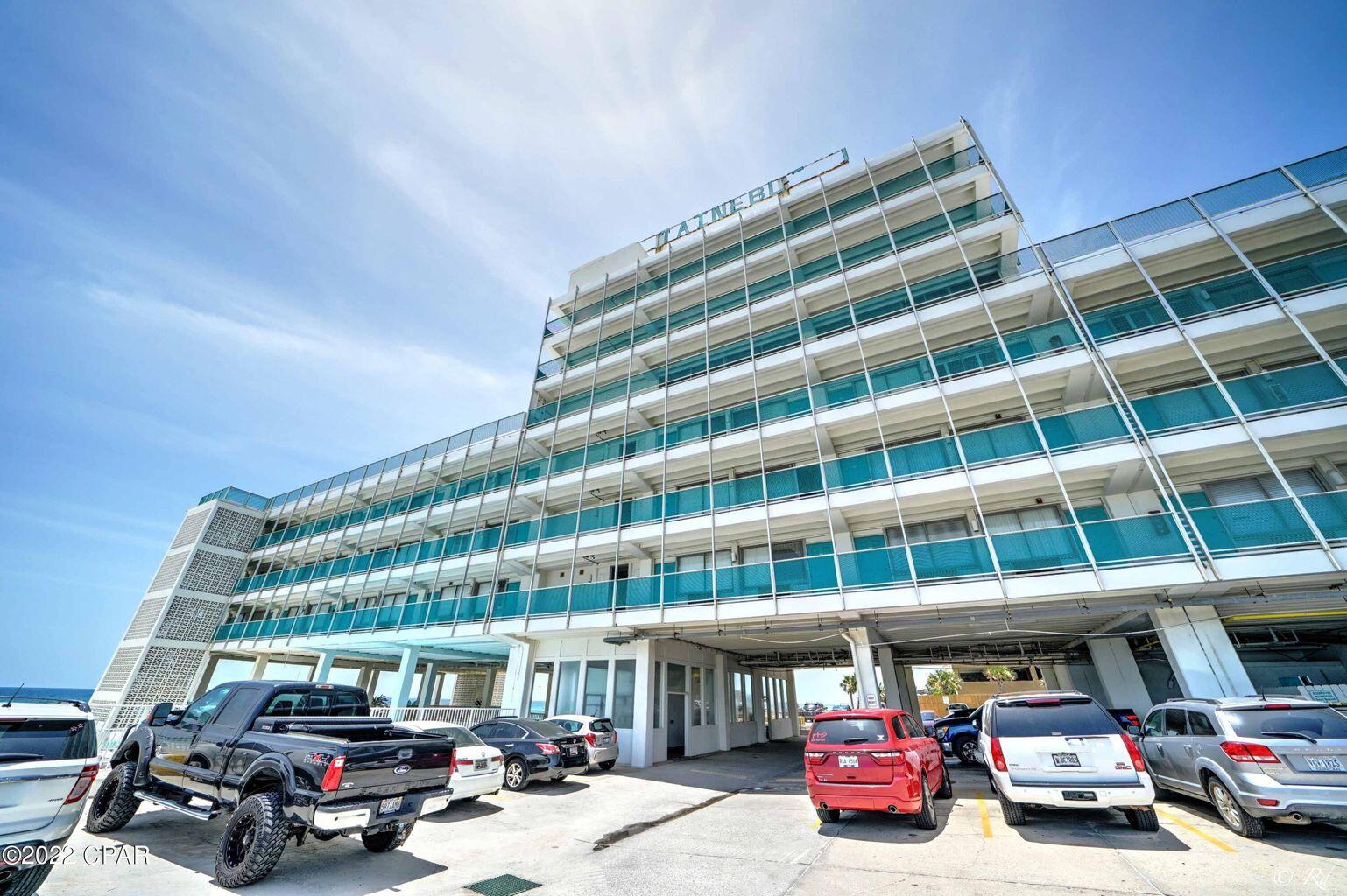 14401 Front Beach Road, Unit 434 Panama City Beach, FL 32413 - Photo 15 of 36 a front view of building with lot of cars parked