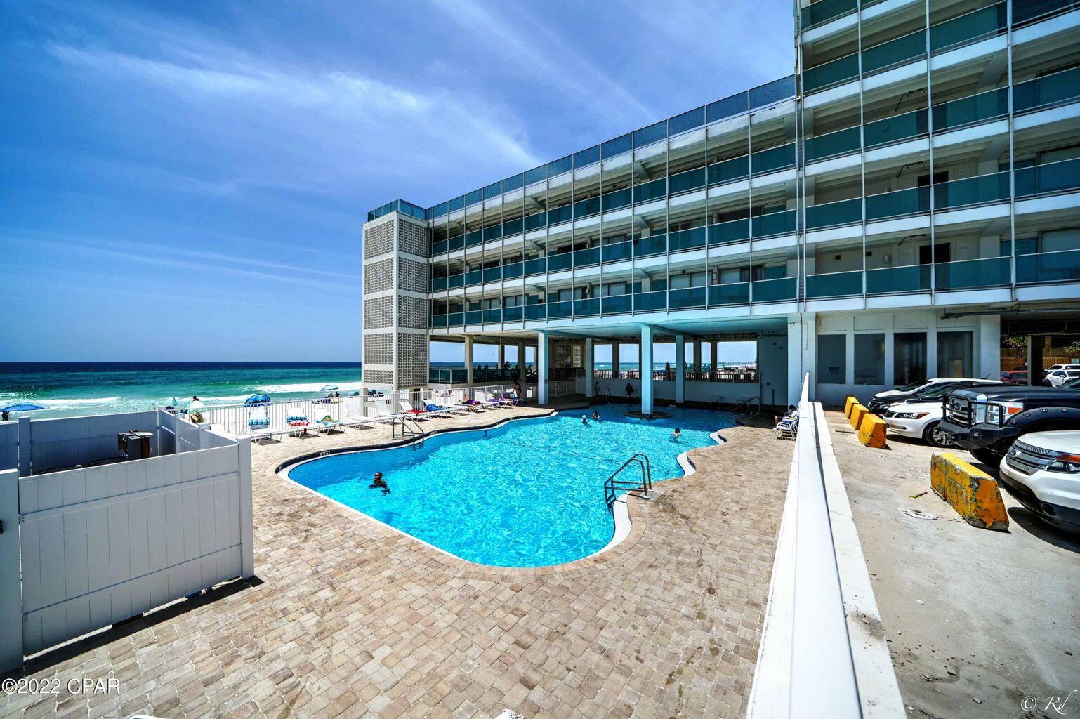 14401 Front Beach Road, Unit 434 Panama City Beach, FL 32413 - Photo 16 of 36 a view of a swimming pool with a patio