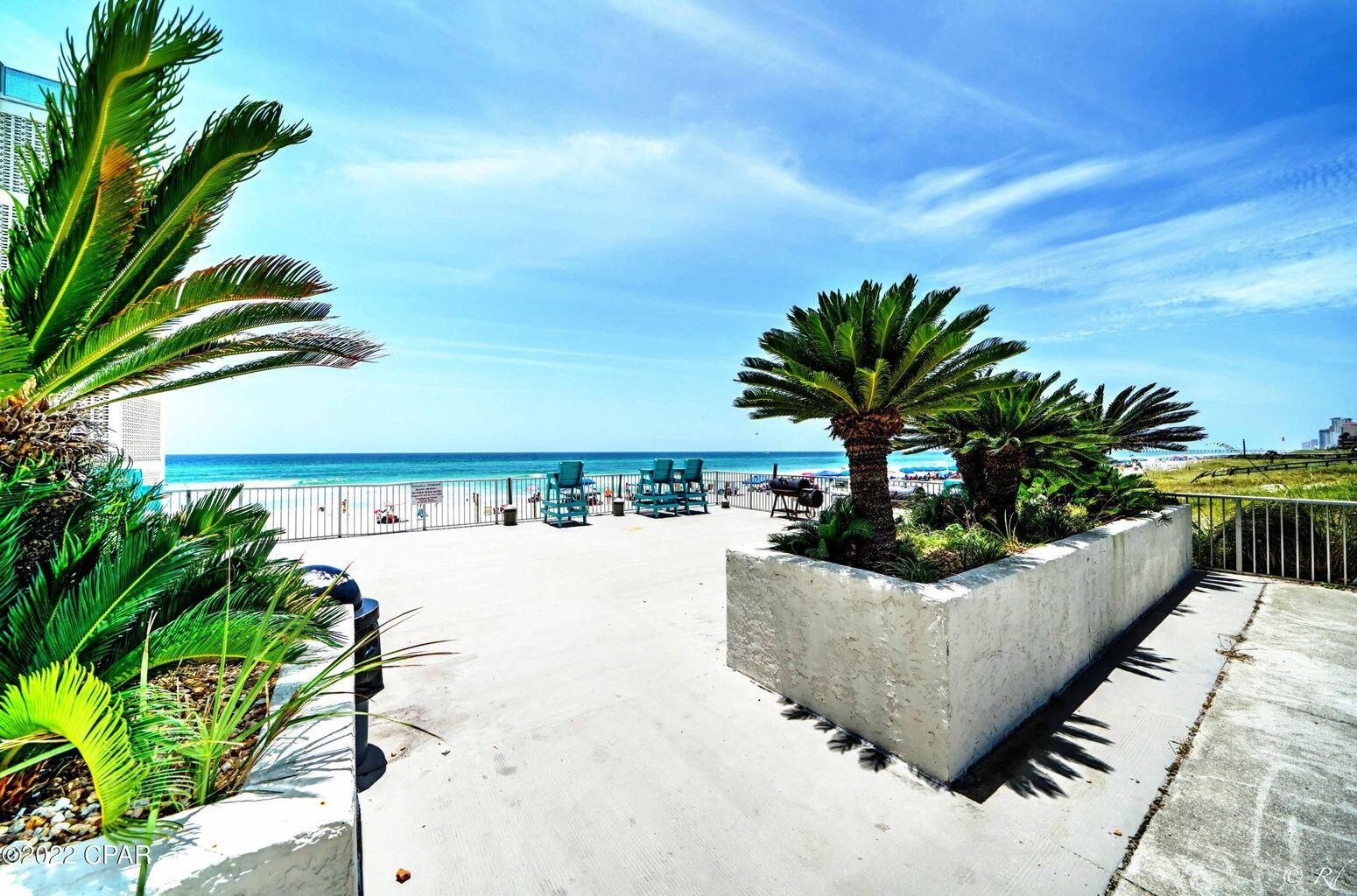 14401 Front Beach Road, Unit 434 Panama City Beach, FL 32413 - Photo 17 of 36 a view of a swimming pool with a patio