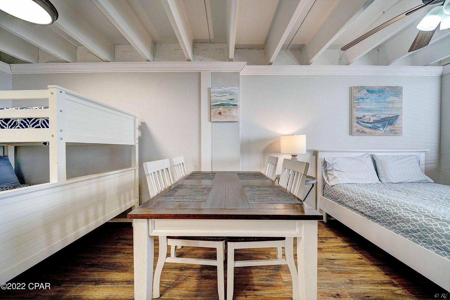 14401 Front Beach Road, Unit 434 Panama City Beach, FL 32413 - Photo 5 of 36 a bedroom with a bed and a flat tv screen on dresser