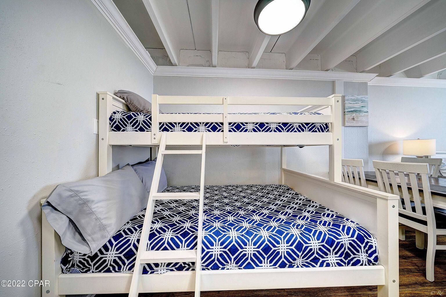 14401 Front Beach Road, Unit 434 Panama City Beach, FL 32413 - Photo 9 of 36 a living room with a rug and a table