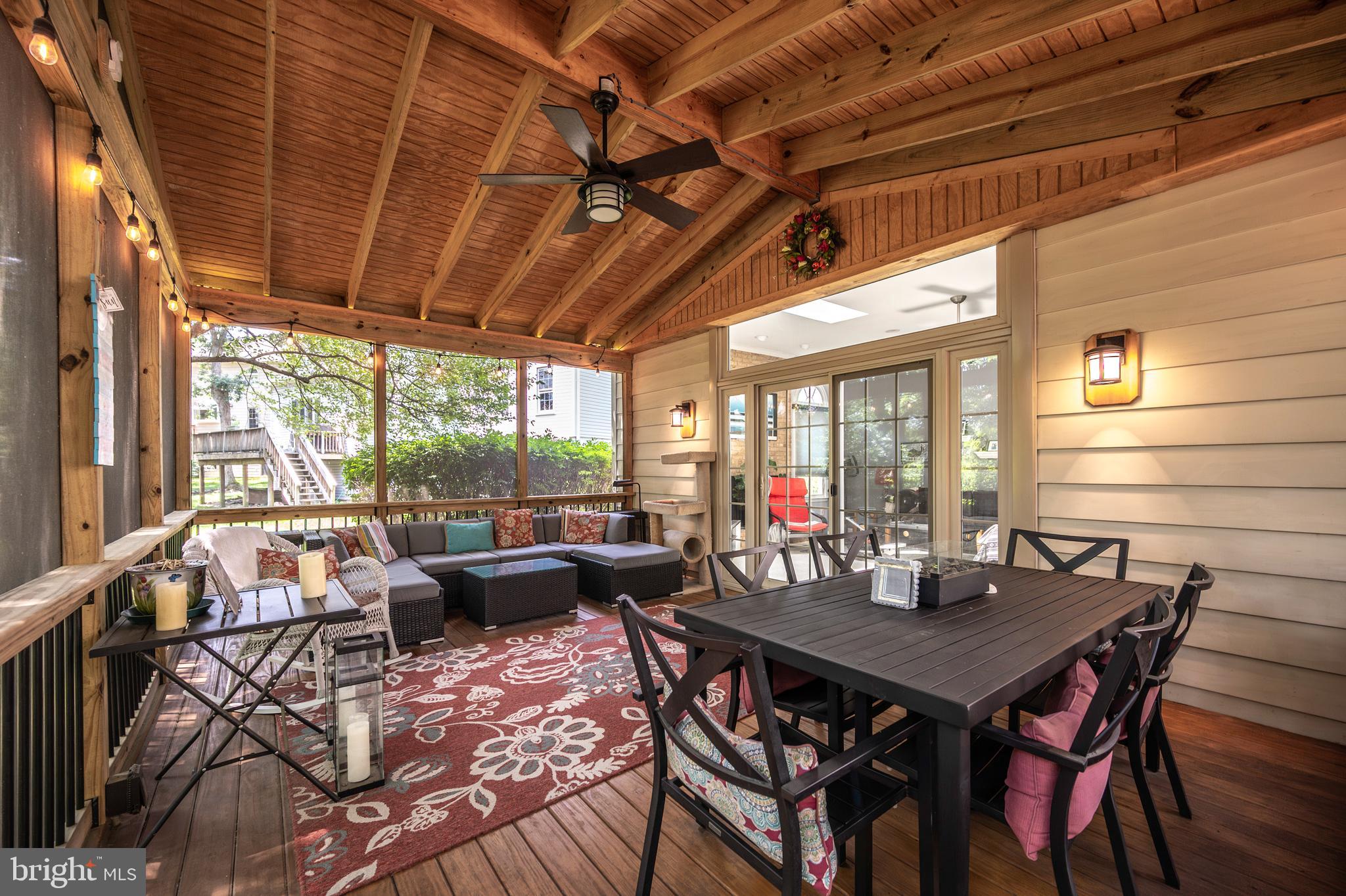 6909 Trillium Lane Springfield, VA 22152 - Photo 8 of 36 a view of a dining room with furniture wooden floor and a potted plant