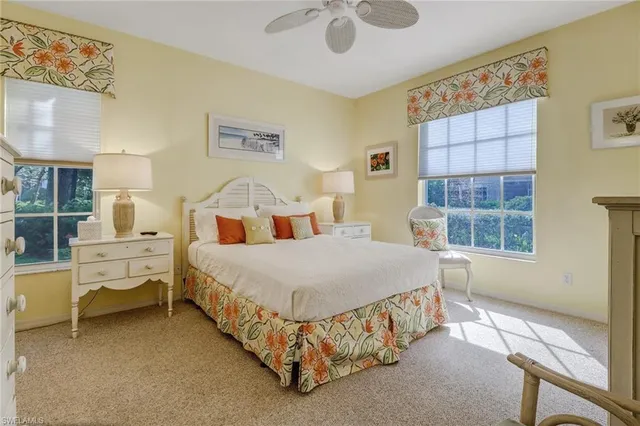 a bedroom with a bed and flat screen tv