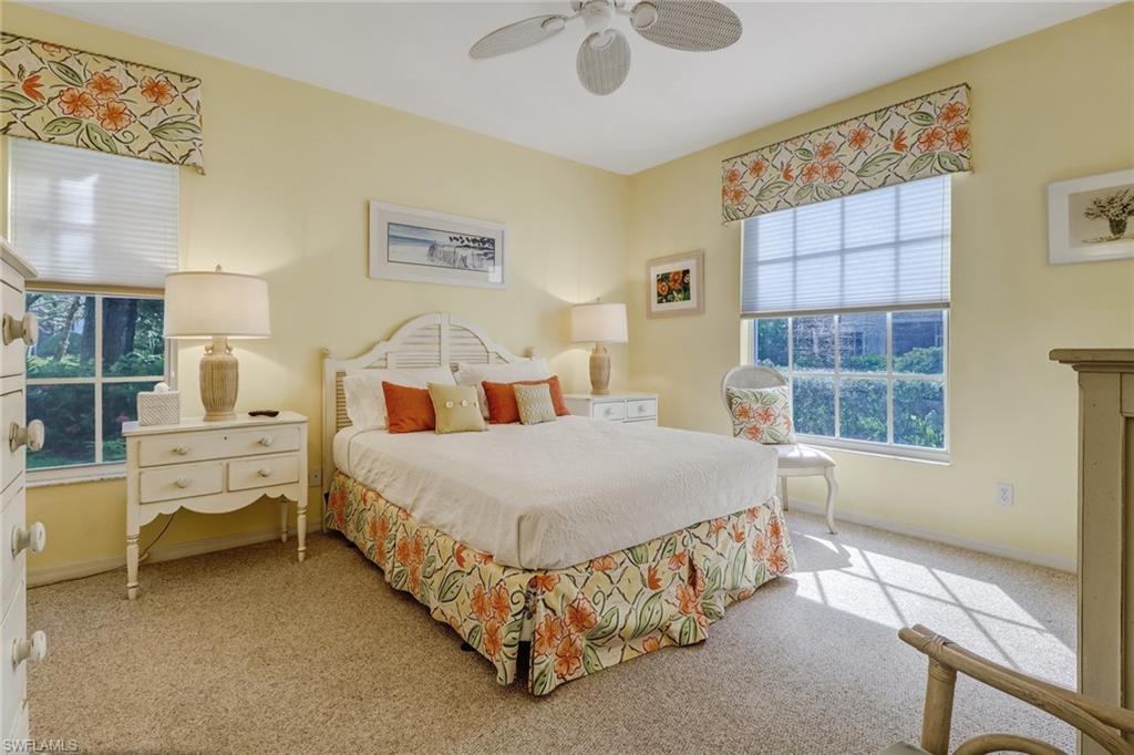 7108 Barrington Circle, Unit 101 Naples, FL 34108 - Photo 15 of 30 a bedroom with a bed and a window
