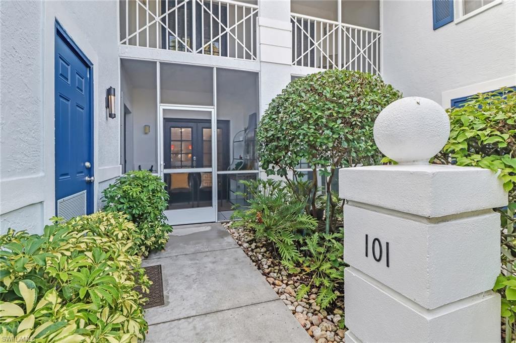 7108 Barrington Circle, Unit 101 Naples, FL 34108 - Photo 2 of 30 a view of entryway with flower pots