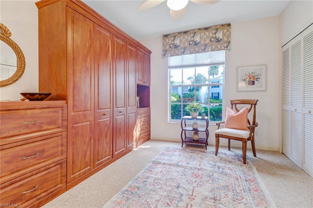 7108 Barrington Circle, Unit 101 Naples, FL 34108 - Photo 22 of 30 a living room with furniture and a window