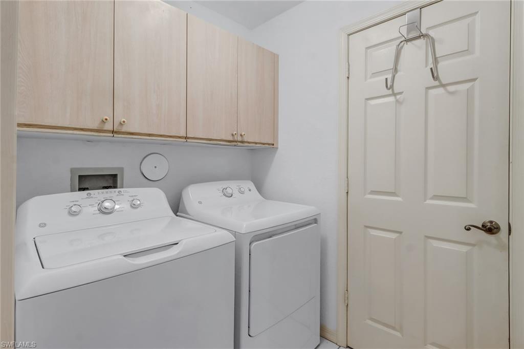 7108 Barrington Circle, Unit 101 Naples, FL 34108 - Photo 23 of 30 a utility room with dryer and washer