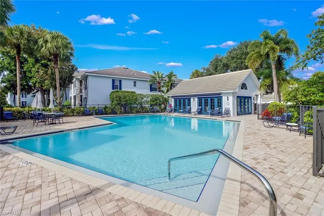 a view of a backyard with sitting area