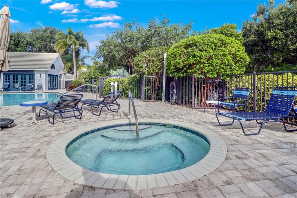 7108 Barrington Circle, Unit 101 Naples, FL 34108 - Photo 28 of 30 a view of a backyard with sitting area