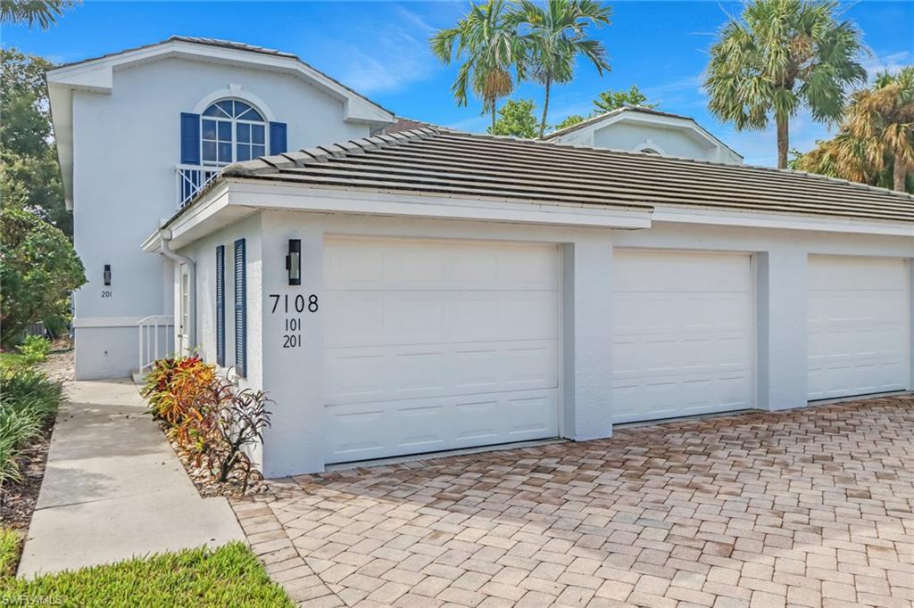 7108 Barrington Circle, Unit 101 Naples, FL 34108 - Photo 3 of 30 a front view of a house